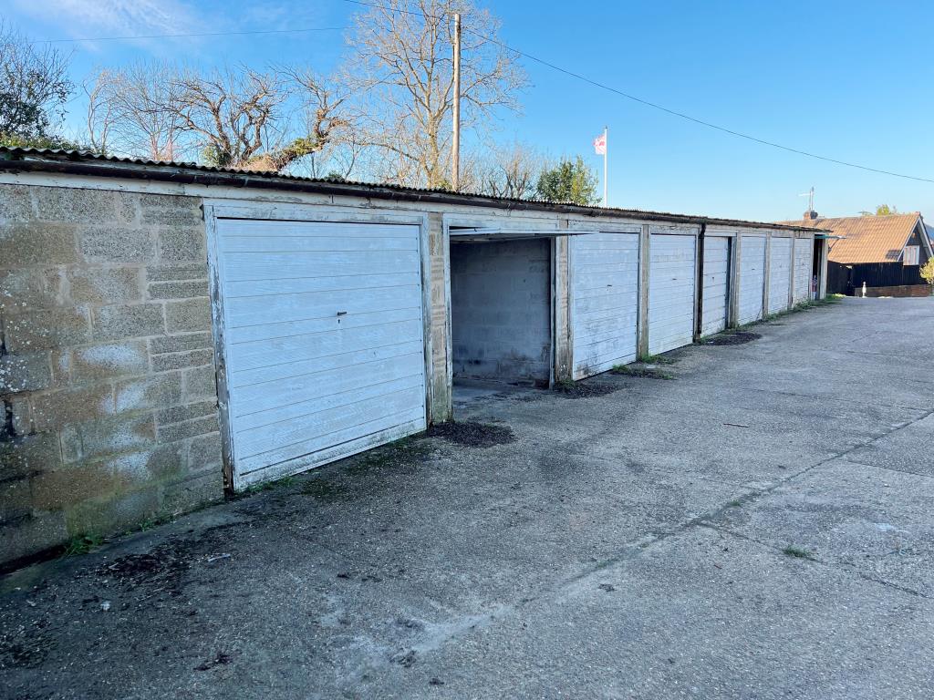 Lot: 83 - FREEHOLD BLOCK OF 19 GARAGES - Lock-up garages with up and over doors